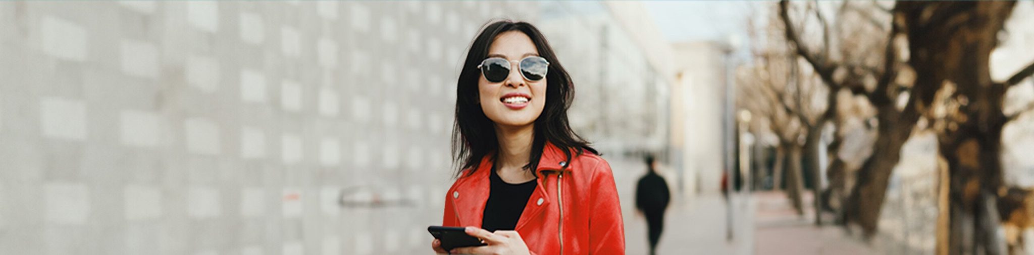 Woman With a red coat, glasses, cellphone