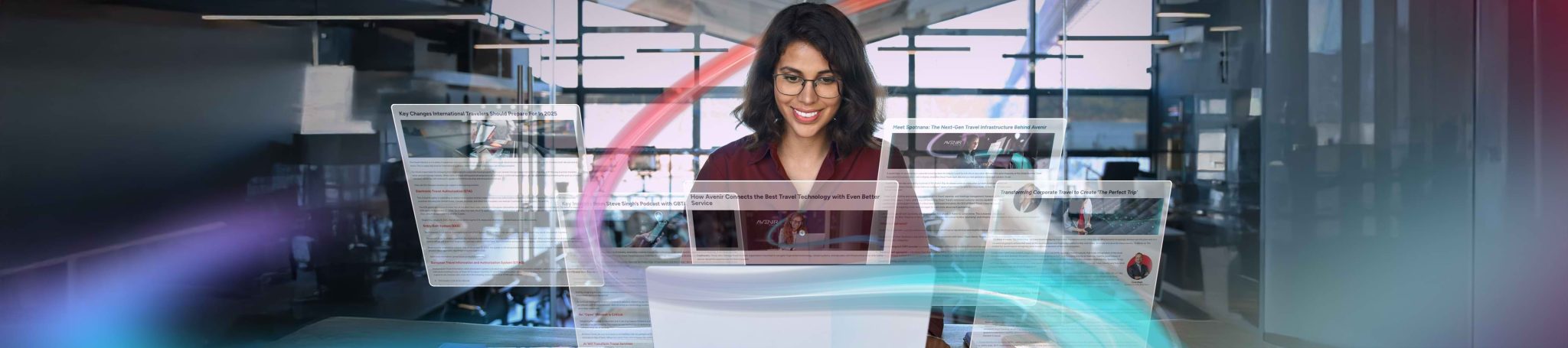 Woman in front of computers reading blog posts about Avenir